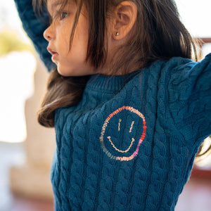 Close up of happy face embroidery. 