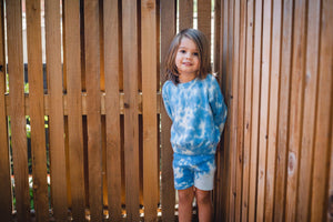 Kids light blue tie dye sweater and shorts. 