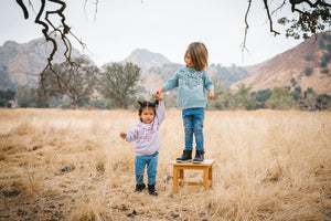 Kids chambray blue bandana print sweater; kids lilac purple bandana print sweater.