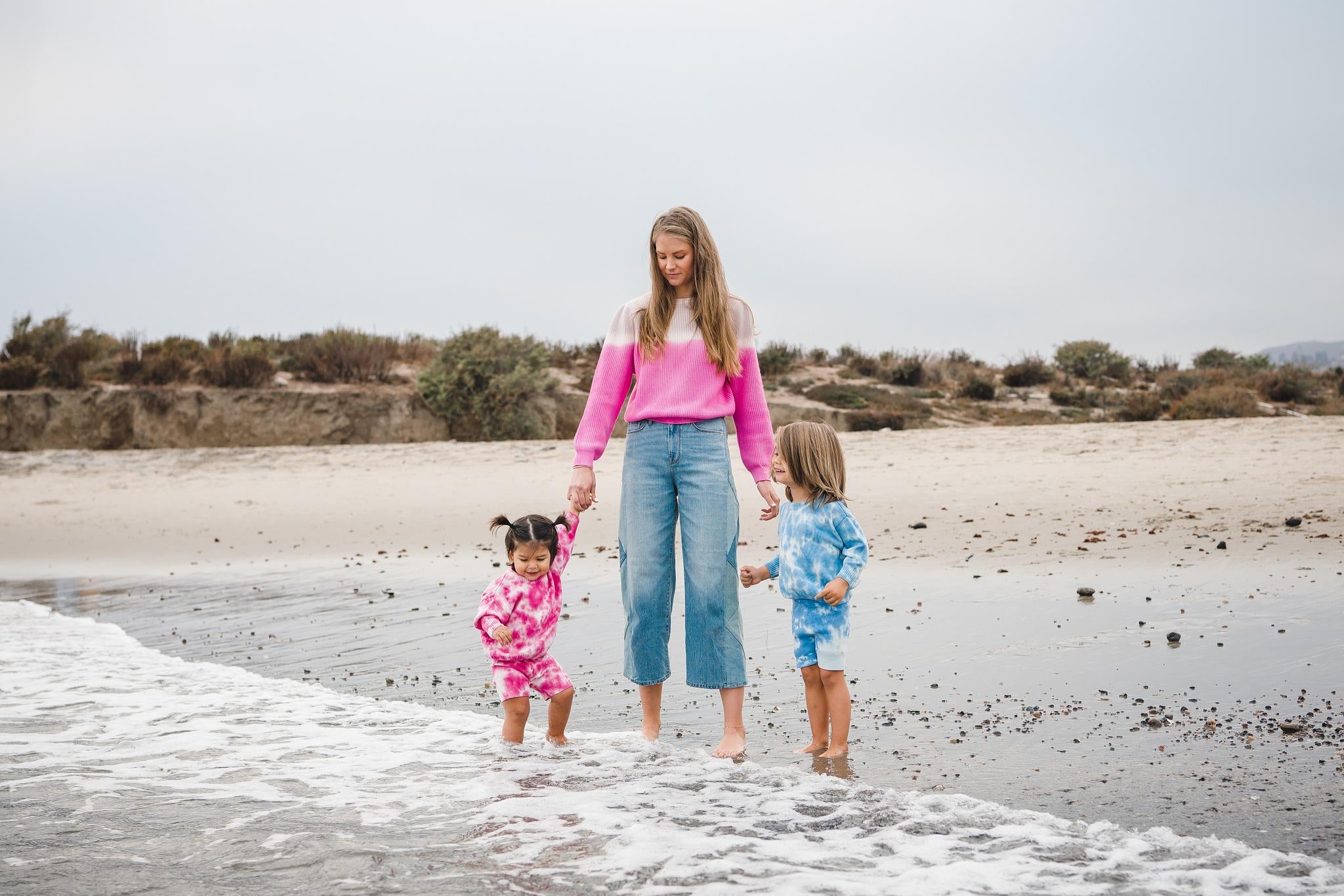 Kids tie dye sweater and shorts in pink and blue and women's pink dip dye sweater. 