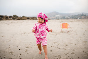 Kids fuchsia pink tie dye beret hat, matching sweater and shorts. 