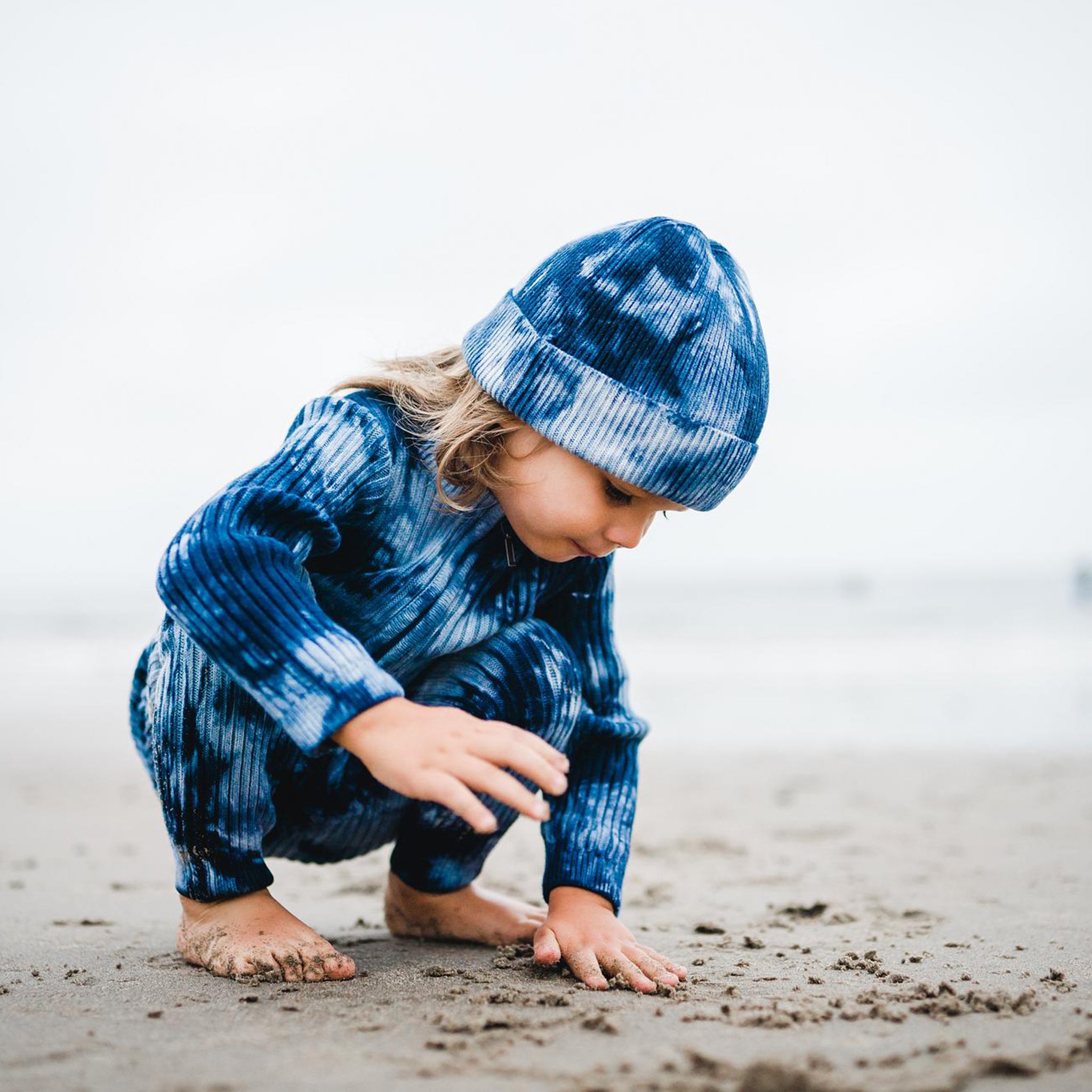 Kids indigo blue tie dye beanie hat and matching onesie. 