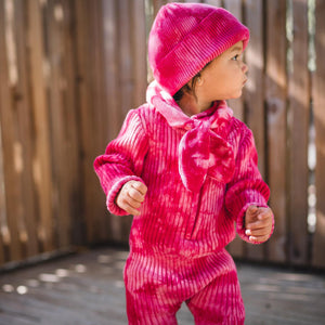 Kids matching fuchsia beanie hat, scarf and onesie. 